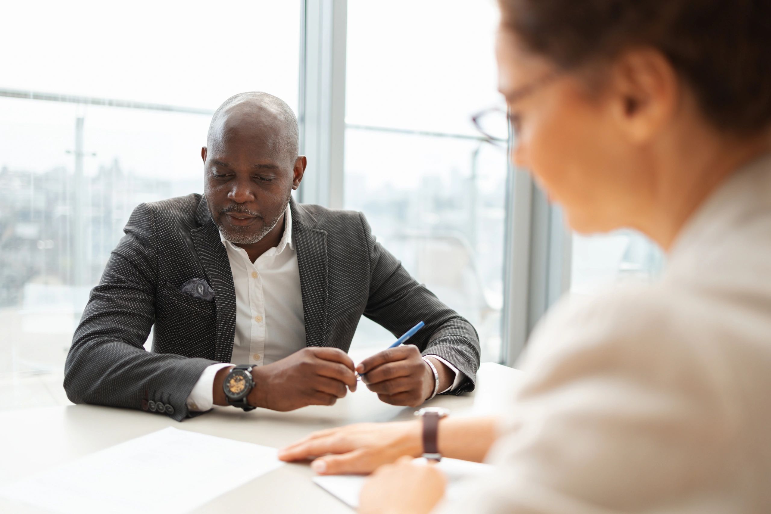 Consultant and business leader in a focused meeting